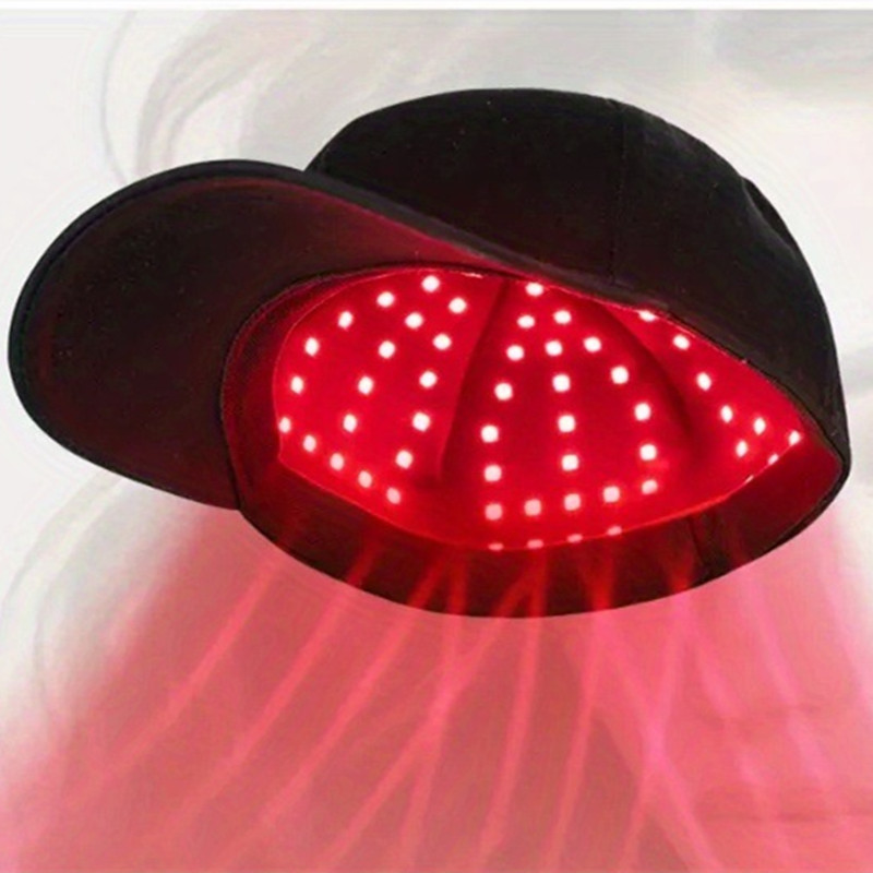 Red light therapy device with glowing red LEDs on a white background